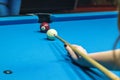 Hand hold a billiard stick on a billiard table ready to hit the Royalty Free Stock Photo