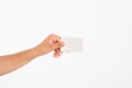 Hand hold blank business card. female arm hold paper isolated on white background. copy space. mock up. Royalty Free Stock Photo