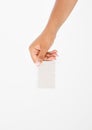 Hand hold blank business card. female arm hold paper isolated on white background. copy space. mock up. Royalty Free Stock Photo