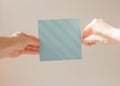 Hand hold blank business card. Mockup of female hands holding blank paper list isolated at white background with shadow Royalty Free Stock Photo