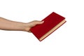 Hand hold blank red hardcover book on white background.