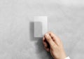 Hand hold blank vertical translucent card mockup with rounded corners Royalty Free Stock Photo