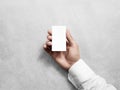 Hand hold blank vertical white business card design mockup. Royalty Free Stock Photo