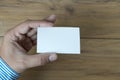 Hand hold blank white card mockup Business branding. Royalty Free Stock Photo