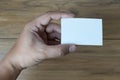 Hand hold blank white card mockup Business branding. Royalty Free Stock Photo