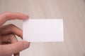 Hand hold blank white card mockup with rounded corners. Plain call-card mock up template holding arm. Plastic credit namecard Royalty Free Stock Photo