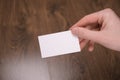 Hand hold blank white card mockup with rounded corners. Plain call-card mock up template holding arm. Plastic credit namecard Royalty Free Stock Photo