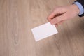 Hand hold blank white card mockup with rounded corners. Plain call-card mock up template holding arm. Plastic credit namecard Royalty Free Stock Photo