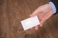 Hand hold blank white card mockup with rounded corners. Plain call-card mock up template holding arm. Plastic credit namecard Royalty Free Stock Photo