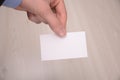 Hand hold blank white card mockup with rounded corners. Plain call-card mock up template holding arm. Plastic credit namecard Royalty Free Stock Photo