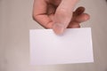 Hand hold blank white card mockup with rounded corners. Plain call-card mock up template holding arm. Plastic credit namecard Royalty Free Stock Photo