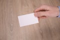 Hand hold blank white card mockup with rounded corners. Plain call-card mock up template holding arm. Plastic credit namecard Royalty Free Stock Photo