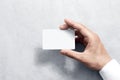 Hand hold blank white card mockup with rounded corners