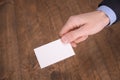 Hand hold blank white card mockup with rounded corners. Plain call-card mock up template holding arm. Plastic credit namecard Royalty Free Stock Photo