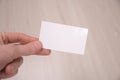 Hand hold blank white card mockup with rounded corners. Plain call-card mock up template holding arm. Plastic credit namecard Royalty Free Stock Photo