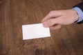 Hand hold blank white card mockup with rounded corners. Plain call-card mock up template holding arm. Plastic credit namecard Royalty Free Stock Photo