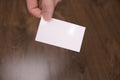 Hand hold blank white card mockup with rounded corners. Plain call-card mock up template holding arm. Plastic credit namecard Royalty Free Stock Photo