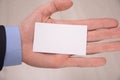 Hand hold blank white card mockup with rounded corners. Plain call-card mock up template holding arm. Plastic credit namecard Royalty Free Stock Photo