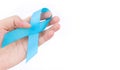 Hand hold blue ribbon on white background prostate cancer awareness concept Royalty Free Stock Photo