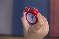 Hand hold clock, someone look time on clock. Royalty Free Stock Photo