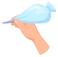 Hand hold cream piping bag. Icing cartoon icon