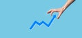 Hand hold drawing on screen growing graph, arrow of positive growth icon.pointing at creative business chart with upward arrows. Royalty Free Stock Photo