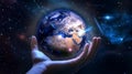 hand hold earth globe cosmic univerce starry flares planet concept