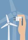 Hand hold eco power plug and Wind turbines Royalty Free Stock Photo