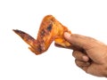 Hand hold grilled chicken wing Royalty Free Stock Photo