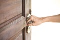 Hand hold handle of wood door Royalty Free Stock Photo