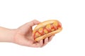 Hand hold hotdog ketchup and mustard.