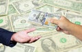 Hand hold many US Dollar with US Dollar banknote background. Royalty Free Stock Photo