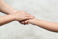 Hand hold mom Concept Love the giver Of mothers with children On blurred background nature