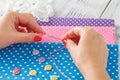 Hand hold needle sew a button Royalty Free Stock Photo