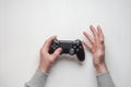 Hand hold new joystick isolated. Gamer play game with gamepad controller. Gaming man holding simulator joypad. Person with keypad Royalty Free Stock Photo