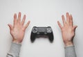 Hand hold new joystick isolated. Gamer play game with gamepad controller. Gaming man holding simulator joypad. Person with keypad Royalty Free Stock Photo