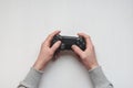 Hand hold new joystick isolated. Gamer play game with gamepad controller. Gaming man holding simulator joypad. Person with keypad Royalty Free Stock Photo