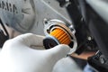 Hand hold New Engine oil filter change Royalty Free Stock Photo