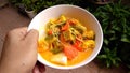 Hand hold sayur Lodeh Vegetable Soup Malaysian Dish