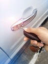 Hand hold to key unlock door car Royalty Free Stock Photo