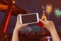 Hand hold and touch screen cellphone ,mobile over blurred night city scape
