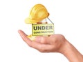 Hand hold traffic cone. Under construction concept Royalty Free Stock Photo