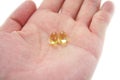 Hand hold two yellow gel pills Royalty Free Stock Photo
