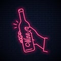 Hand hold wine bottle neon sign. Male hand holding