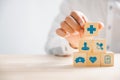 Hand hold wooden block with icon healthcare medical Royalty Free Stock Photo