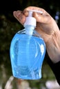 hand holdinf bottle of a virus sanitizer Royalty Free Stock Photo