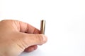 Hand holding AA battery isolated on white Royalty Free Stock Photo