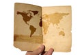 Hand holding aged world map Royalty Free Stock Photo