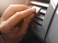 Hand holding air conditioner vents car. Royalty Free Stock Photo