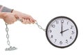 Hand holding an alarm wall clock, time management concept Royalty Free Stock Photo